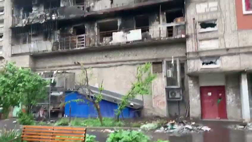 106 — burnt-out upper-floor balconies, May 2022